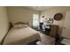 Bedroom features a comfortable bed, desk, and sporty decor, creating an inviting and functional space at 130 Southern Pecan Cir # 204, Winter Garden, FL 34787