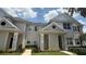 Charming two-story townhome with neutral siding, well-kept landscaping, and inviting entrance at 130 Southern Pecan Cir # 204, Winter Garden, FL 34787