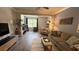 Cozy living room featuring hardwood floors, comfortable seating, and neutral color palette at 130 Southern Pecan Cir # 204, Winter Garden, FL 34787