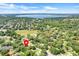 Aerial view of the neighborhood with lake and a serene and picturesque setting at 1311 Rain Forest Ln, Minneola, FL 34715