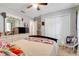 Spacious bedroom with ceiling fan, ample natural light, and generous closet space at 1311 Rain Forest Ln, Minneola, FL 34715