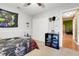 Bedroom with carpet, closet, and gaming decor at 1311 Rain Forest Ln, Minneola, FL 34715