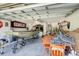 Spacious garage equipped with boat, trailer, tools and storage options at 1311 Rain Forest Ln, Minneola, FL 34715