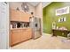 Bright kitchen featuring stainless steel refrigerator, modern appliances, ample counter space, and plenty of cabinetry for storage at 1311 Rain Forest Ln, Minneola, FL 34715