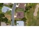 This aerial shot displays a home nestled among others on a street adjacent to the golf course at 13165 Se 93Rd Cir, Summerfield, FL 34491