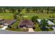 An aerial view showcases the home's placement along the golf course with mature trees throughout the community at 13165 Se 93Rd Cir, Summerfield, FL 34491