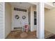 Inviting double door entry featuring a charming rocking chair and delightful wreaths at 13165 Se 93Rd Cir, Summerfield, FL 34491