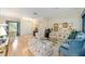 Bright living room with hardwood floors, stylish furniture, and tasteful decor at 13165 Se 93Rd Cir, Summerfield, FL 34491