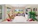 Cozy living room with large windows offering a scenic outdoor view at 13165 Se 93Rd Cir, Summerfield, FL 34491