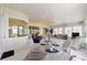 Inviting sunroom with large windows, ample seating, and views of the outdoor area at 13165 Se 93Rd Cir, Summerfield, FL 34491