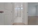 En suite bathroom with walk-in shower, tile floors, and white cabinets at 14249 Crest Palm Ave, Windermere, FL 34786