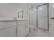 Modern bathroom features white marble floors and a glass-enclosed shower at 14249 Crest Palm Ave, Windermere, FL 34786