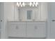 Modern bathroom vanity with dual sinks and new fixtures at 14249 Crest Palm Ave, Windermere, FL 34786