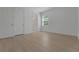 Bedroom showcasing tile floors, white doors, and a window at 14249 Crest Palm Ave, Windermere, FL 34786