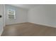 Well-lit bedroom with wood-look floors and a window at 14249 Crest Palm Ave, Windermere, FL 34786