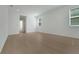 Bright, empty bedroom with hardwood floors, base molding and large windows for natural light at 14249 Crest Palm Ave, Windermere, FL 34786