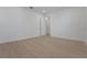 Empty bedroom with hardwood floors, white walls and baseboards, plus a single window at 14249 Crest Palm Ave, Windermere, FL 34786