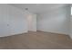 An airy bedroom features light-colored wood floors, crisp white walls, and a double-door closet at 14249 Crest Palm Ave, Windermere, FL 34786