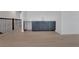 Open bonus room features wood-look flooring and a stylish wet bar at 14249 Crest Palm Ave, Windermere, FL 34786
