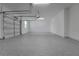 Huge three-car garage with epoxy flooring providing ample parking and storage space at 14249 Crest Palm Ave, Windermere, FL 34786