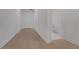 Entry hallway featuring hardwood flooring leading to the half bath and the home entrance at 14249 Crest Palm Ave, Windermere, FL 34786
