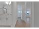 Bright hallway connects the bathroom, bedroom and other rooms, featuring a sleek and modern design at 14249 Crest Palm Ave, Windermere, FL 34786