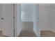 Hallway features wood floors, white walls, and access to a closet and another room at 14249 Crest Palm Ave, Windermere, FL 34786