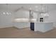 Modern eat-in kitchen with white cabinets, stainless steel appliances, and large island at 14249 Crest Palm Ave, Windermere, FL 34786