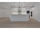 Modern eat-in kitchen with white cabinets, stainless steel appliances, and large island at 14249 Crest Palm Ave, Windermere, FL 34786