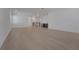 Spacious living room with wood flooring, a wet bar and stairs leading to another level at 14249 Crest Palm Ave, Windermere, FL 34786