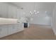 Open-concept living space boasting modern lighting, hardwood floors, and seamless flow at 14249 Crest Palm Ave, Windermere, FL 34786