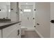 Modern bathroom featuring a glass-enclosed shower and vanity with sleek hardware at 14261 Crest Palm Ave, Windermere, FL 34786