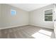 Neutral bedroom with a window and plush carpet, illuminated by natural light at 14261 Crest Palm Ave, Windermere, FL 34786