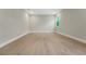 Empty bedroom featuring a large window and plenty of light on wood floors at 14261 Crest Palm Ave, Windermere, FL 34786