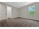 A well-lit bedroom with neutral carpet, trim, and walls at 14261 Crest Palm Ave, Windermere, FL 34786