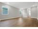 Bright, spacious bedroom with wood floors and two windows for ample natural light at 14261 Crest Palm Ave, Windermere, FL 34786