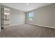 Neutral bedroom featuring soft carpet, bright walls, and an open door to the bathroom at 14261 Crest Palm Ave, Windermere, FL 34786