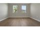 Neutral bedroom with two windows allowing for natural light at 14261 Crest Palm Ave, Windermere, FL 34786