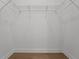 Spacious walk in closet featuring wood floors and wired shelving at 14261 Crest Palm Ave, Windermere, FL 34786