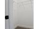 Walk-in closet with wire shelving and neutral carpet flooring offers ample storage space at 14261 Crest Palm Ave, Windermere, FL 34786