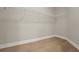 A closet features wire shelving, white trim, and wood-look flooring at 14261 Crest Palm Ave, Windermere, FL 34786