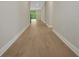 A long hallway with a wall of windows at the end at 14261 Crest Palm Ave, Windermere, FL 34786
