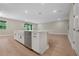 Bright, modern kitchen featuring a large island with a sink and stainless steel appliances at 14261 Crest Palm Ave, Windermere, FL 34786