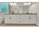 Stylish bathroom with dual sinks, modern fixtures, and ample cabinet space at 14285 Crest Palm Ave, Windermere, FL 34786