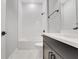 Clean and modern bathroom featuring a tiled shower and dark vanity at 14285 Crest Palm Ave, Windermere, FL 34786