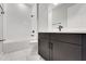 Modern bathroom featuring a tub with white subway tile and dark fixtures at 14285 Crest Palm Ave, Windermere, FL 34786