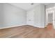 Empty bedroom with hardwood floors, light gray walls, and a closet at 14285 Crest Palm Ave, Windermere, FL 34786