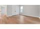 Bedroom featuring wood flooring, a double door closet, and a bright window at 14285 Crest Palm Ave, Windermere, FL 34786