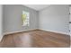 Bright bedroom with hardwood floors and a window at 14285 Crest Palm Ave, Windermere, FL 34786