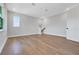 Large bedroom with hardwood floors, natural light, and walk-in closet at 14285 Crest Palm Ave, Windermere, FL 34786